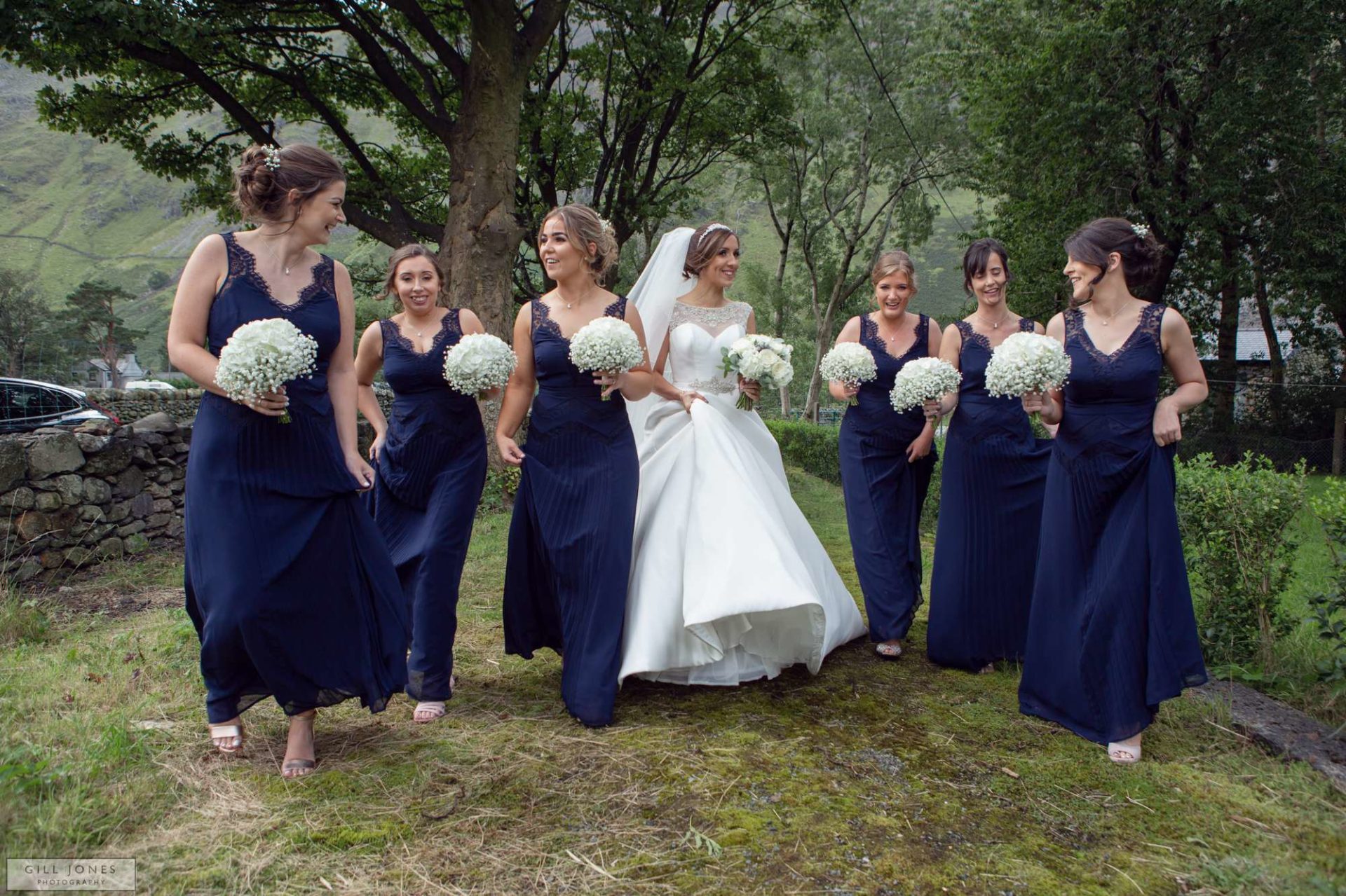 the bride walking with her bridesmaids