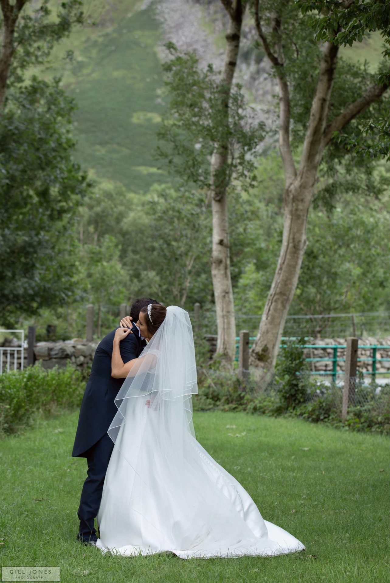 the bride and groom hugging