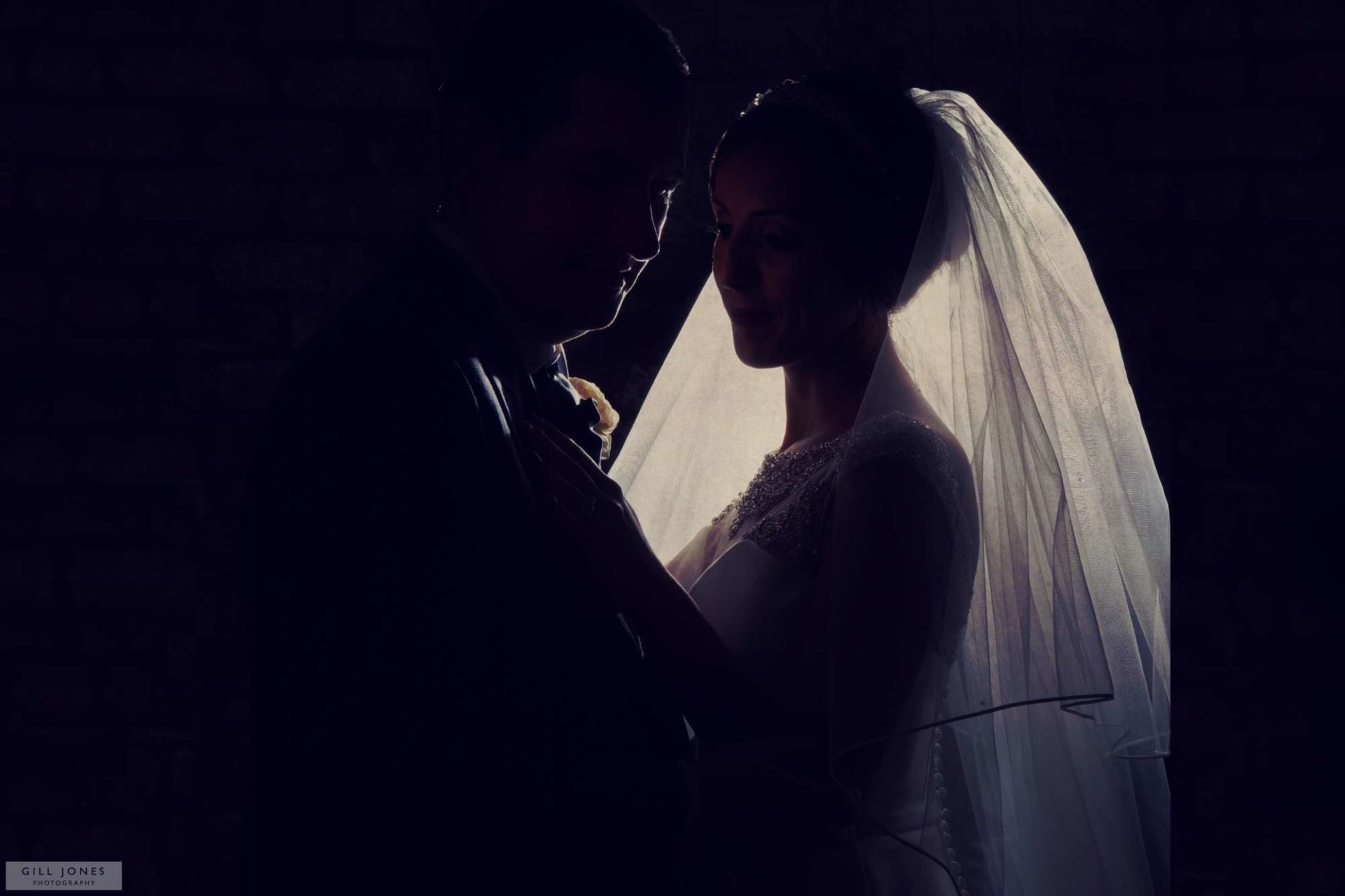 the bride and groom hugging each other