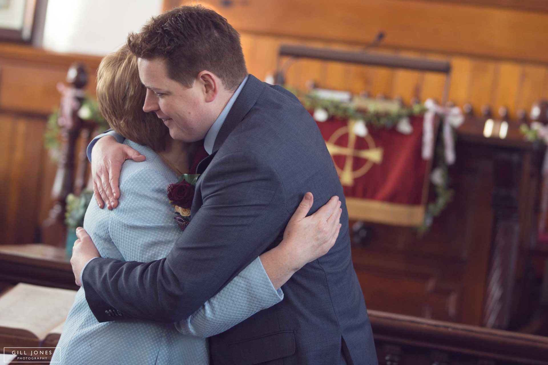 the groom hugs his mother