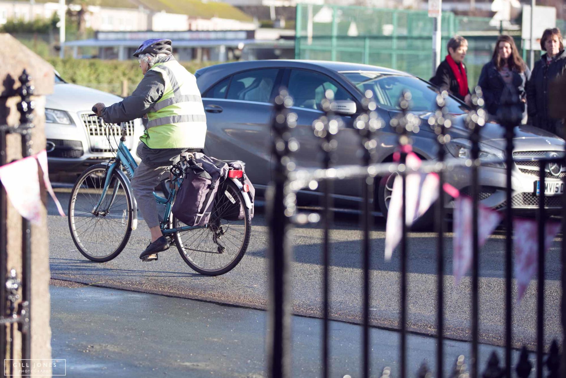 a cyclist riding past the chapel