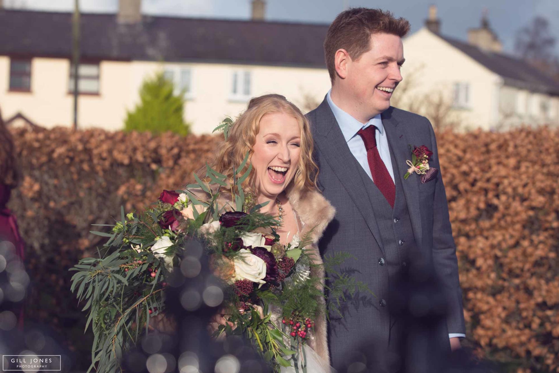 the bride smiling broadly at her guests 