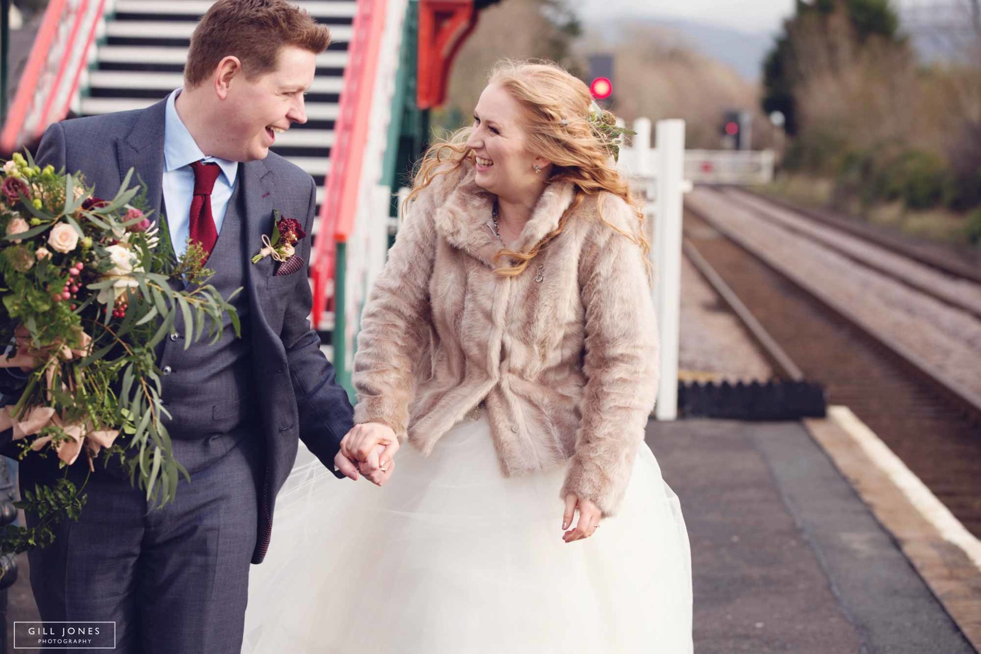 the bride and groom huddled against the cold