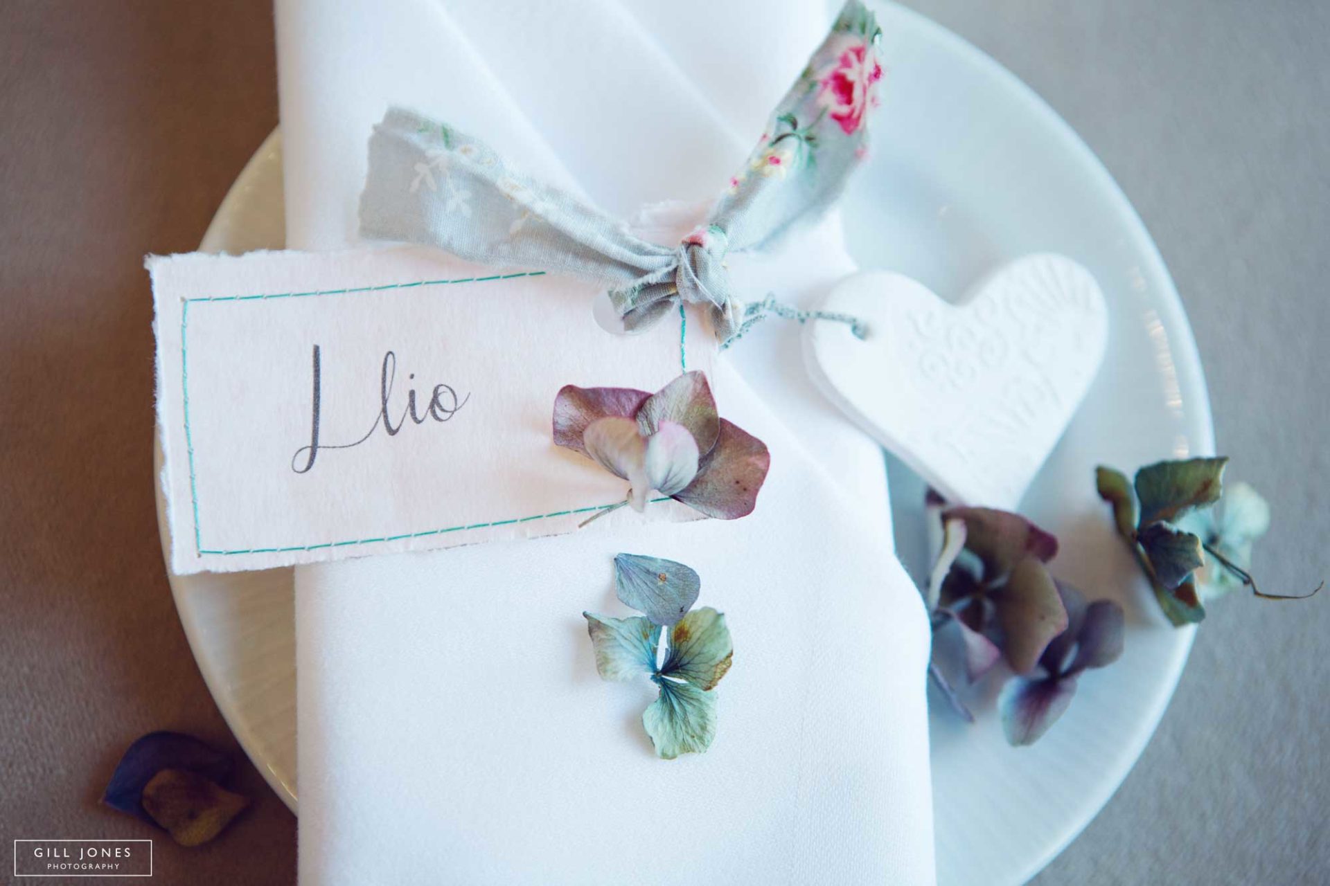 a napkin and ribbon on a side plate