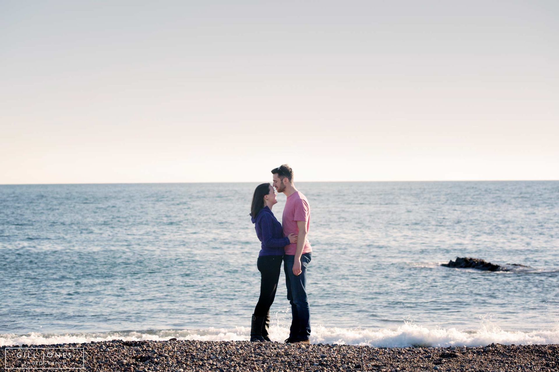 a couple kissing on Llanddwyn Island