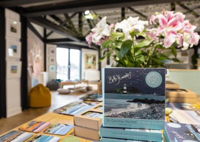 interior of a gallery with a pack of greetings cards in the foreground by Anglesey commercial photographer Gill Jones photography