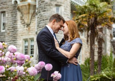 a man and woman's foreheads touch as they look into each other's eyes by Anglesey elopement photographer Gill Jones Photography