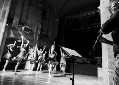 a clarinet player plays for a group of ballet dancers by Anglesey commercial photographer Gill Jones photography