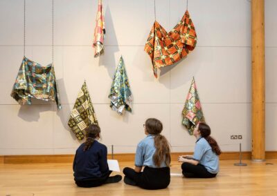 three school pupils consider an art installation at Oriel Mon Anglesey commercial photographer Gill Jones photography