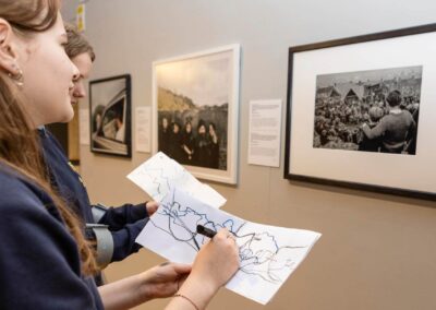 a school pupil copies a drawing in Oriel Mon by Anglesey commercial photographer Gill Jones photography