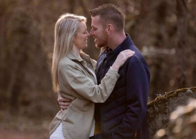 a young couple caress standing nose to nose