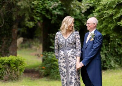 a bride turns to her new husband to smile